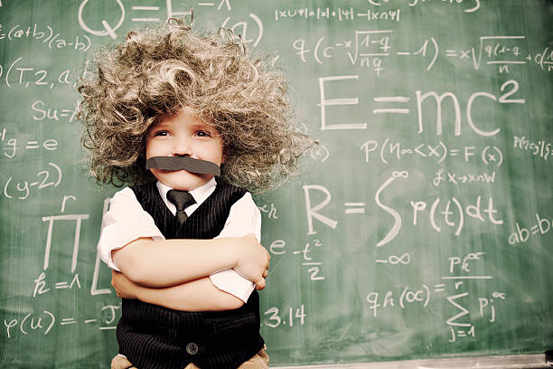 Student studying mathematics in front of a formula board